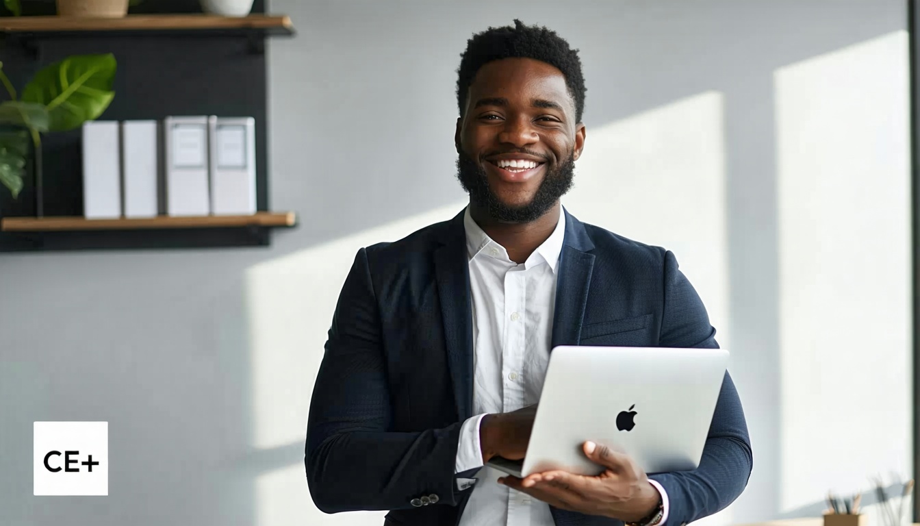 Business person smiling whilst holding a laptop under their arm an office background with a shadow box in light grey to the bottom left corner and text in a white square towards the bottom left  the text saying CE-3